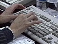 RoyaltyFreeStockVideoSDFootageOfficeWorkerTypingonaComputerKeyboard