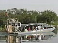 RoyaltyFreeStockVideoSDFootageAirboatDepartsonaTouratHolidayParkintheEvergladesinFlorida