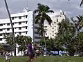 RoyaltyFreeStockVideoSDFootageStaticShotofHotelandRestaurantasPeoplePassByinSouthBeachinthe90s