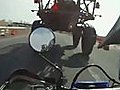 MotorcycleDrivesUnderTruck