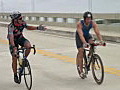 RoyaltyFreeStockVideoHDFootageBicycleRacersRideintheMSCharityBikeRideatCardSoundBridgeinKeyLargoFlorida