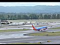 SouthwestAirlinesBoeing737700WithThe2000th737NGDecalTakesOffFromPDXOnRunway28L